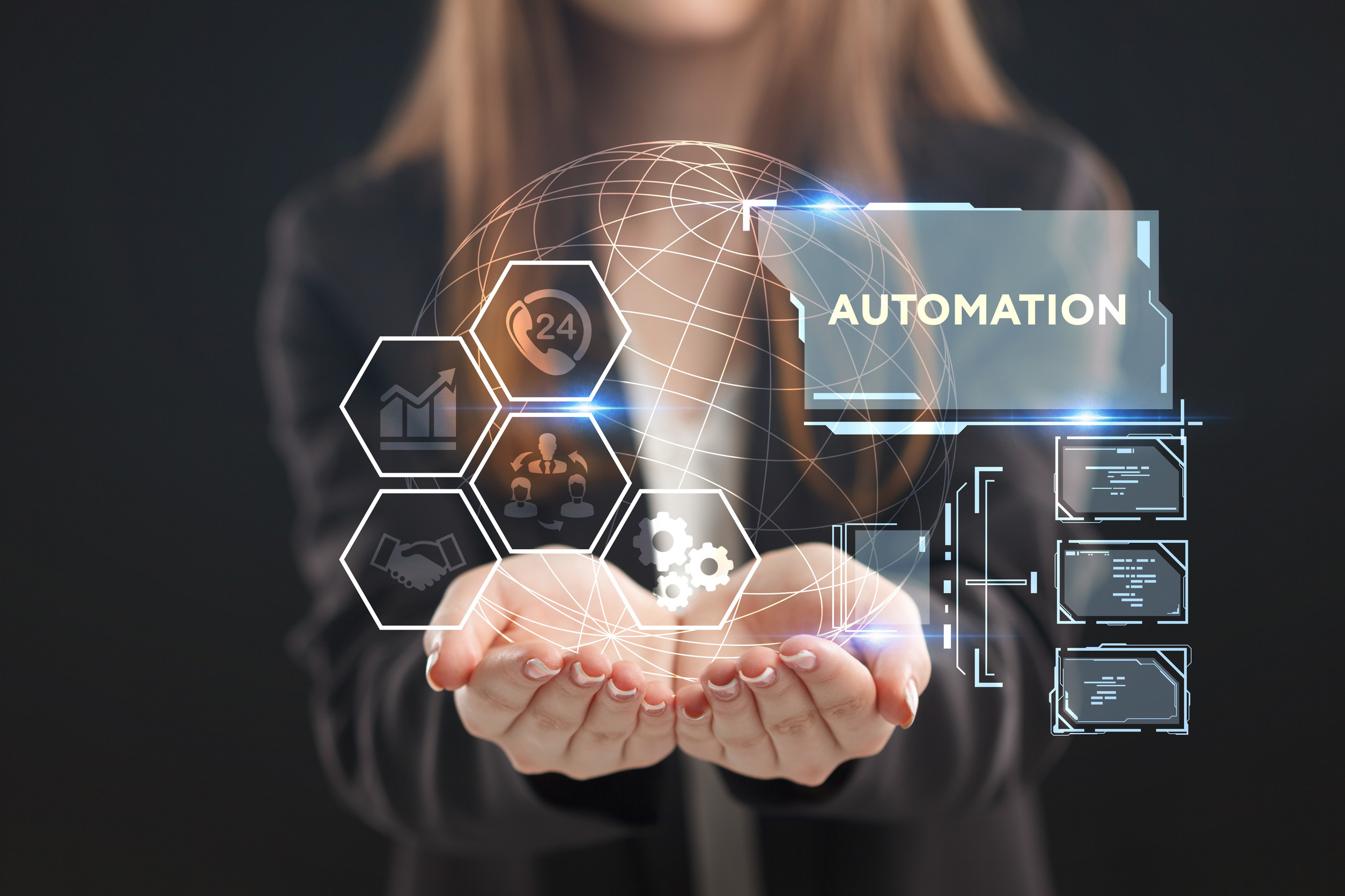  A young entrepreneur working on a virtual screen of the future and sees the inscription: Automation